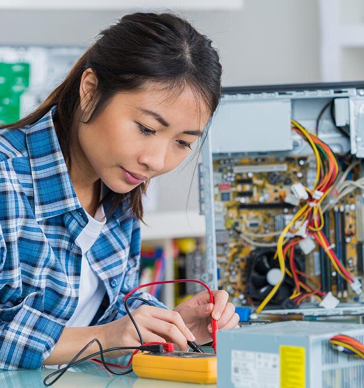 Female student working on circuit board